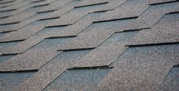 A close up of a roof with shingles on it.