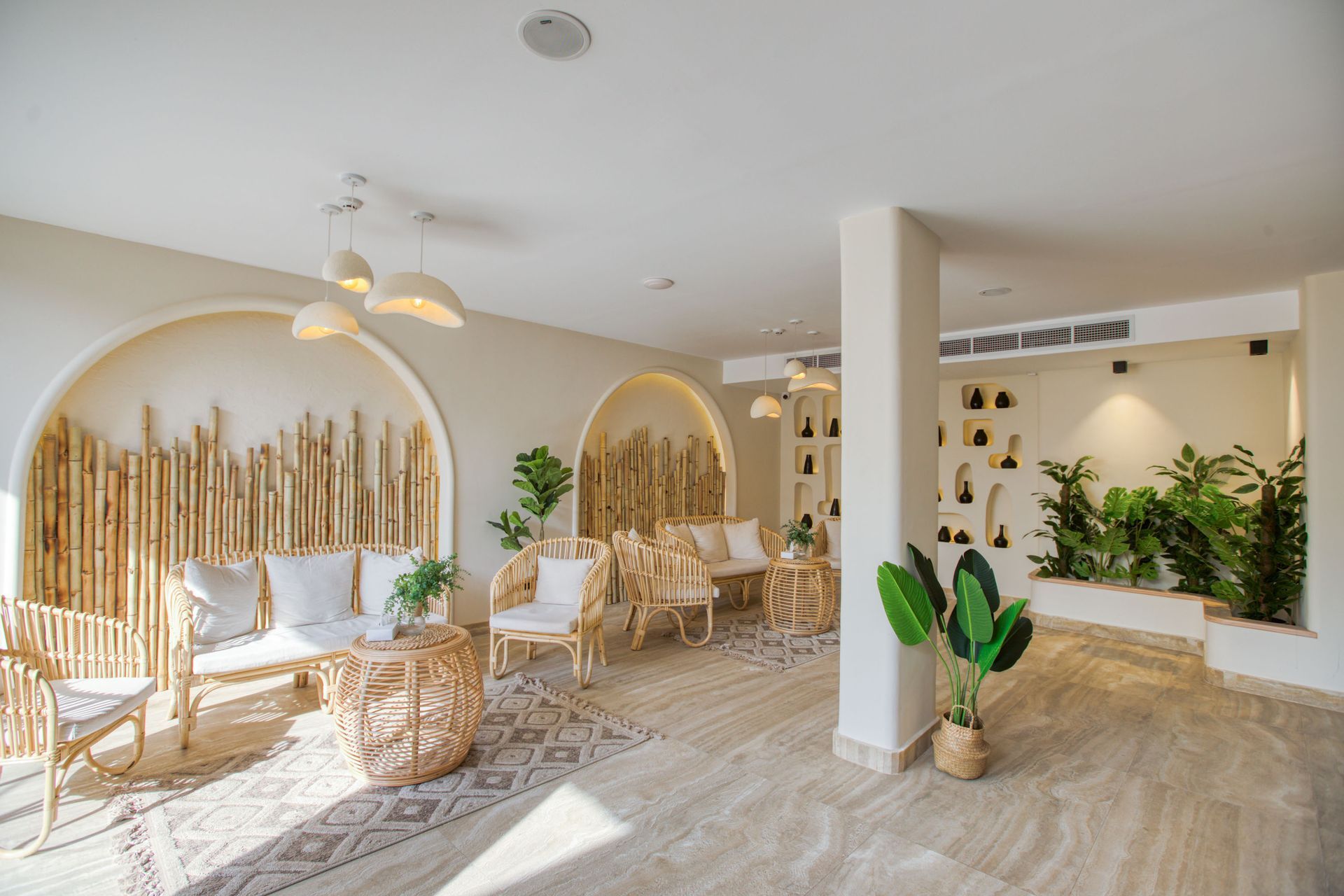 A hotel room with a bed , desk , chair and television.