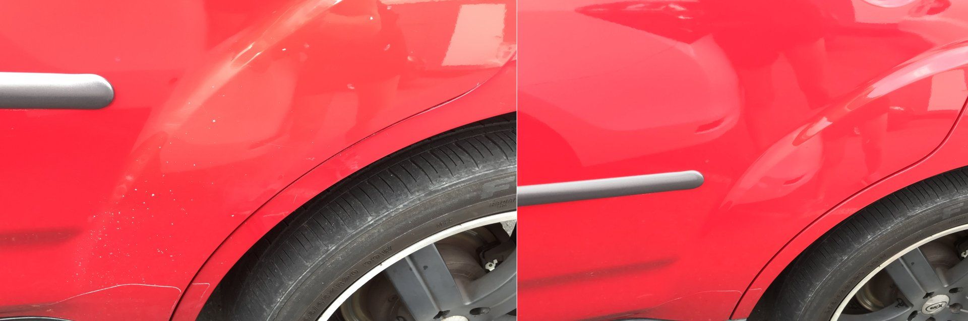 Red car door with a silver handle and a portion of a black tire.