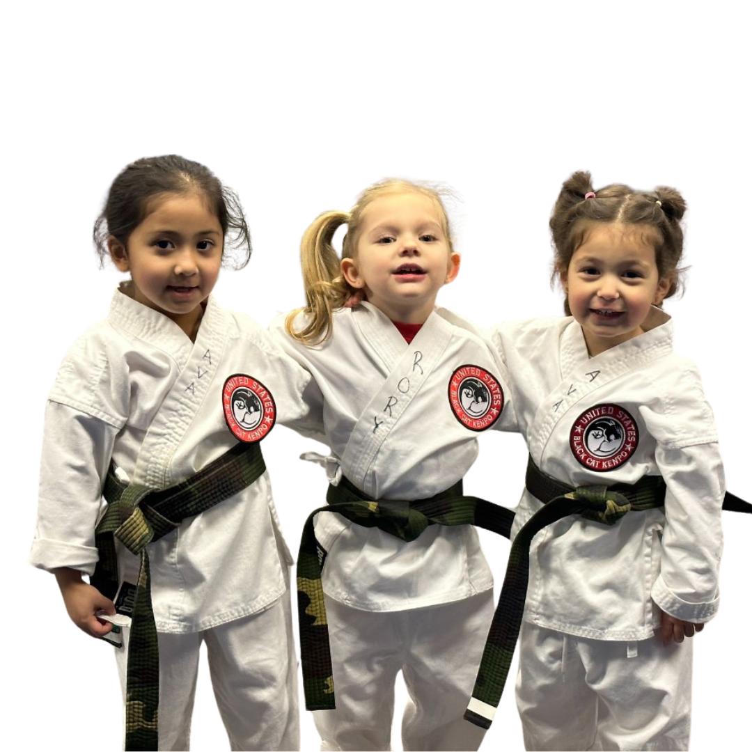 A boy and a girl are practicing karate together.