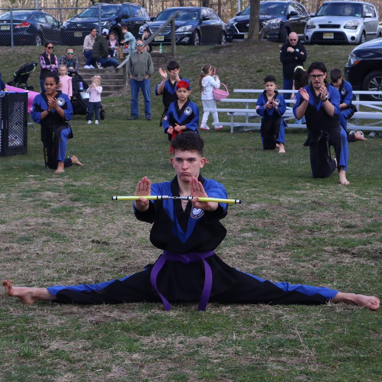 a group of men are practicing karate in a gym