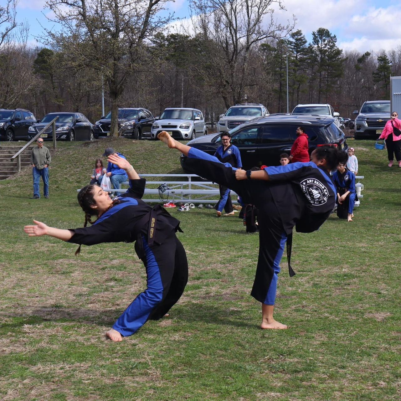 a group of men are practicing karate in a gym