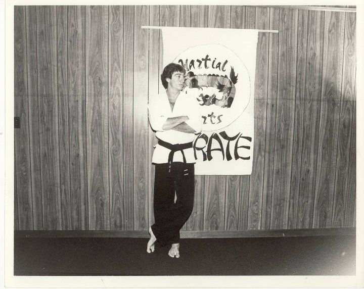 A group of martial arts fighters pose for a photo