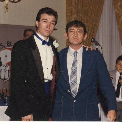 A black and white photo of a group of people in karate uniforms