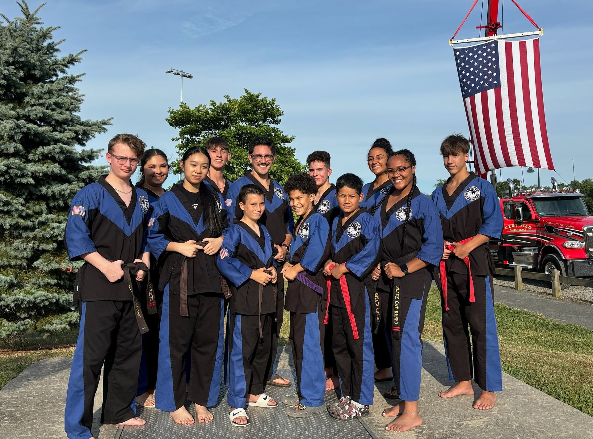 A group of martial arts fighters pose for a photo