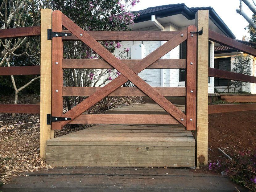 A Wooden Gate With Steps Leading to a House — Fence & Deck Australia Pty Ltd in Casino, NSW