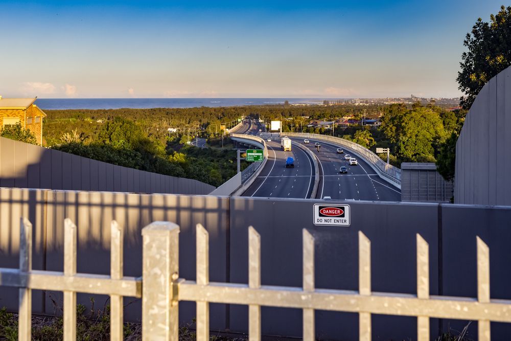 A View of a Highway From Behind a Fence — Fence & Deck Australia Pty Ltd in Banora Point, NSW