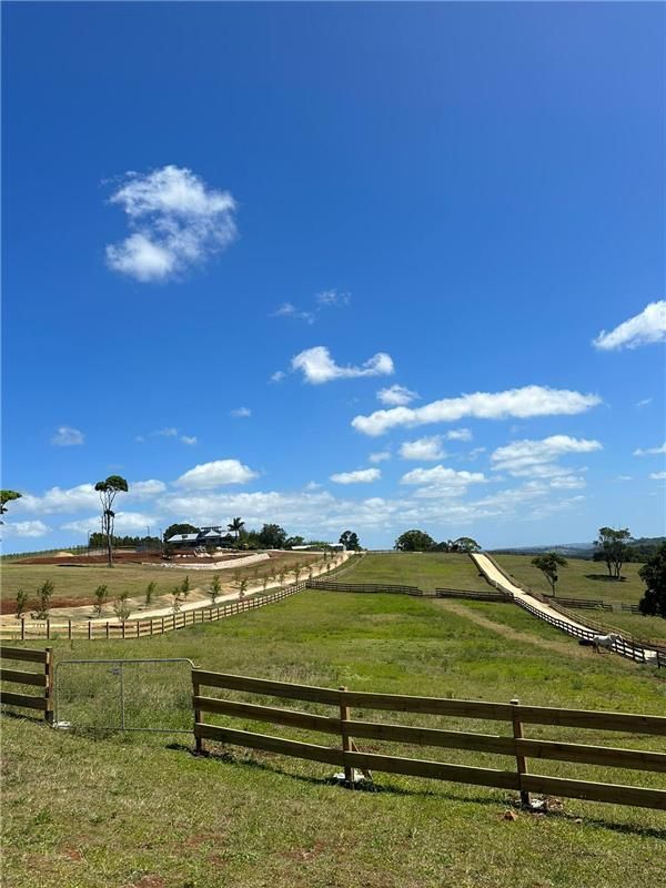 A Wooden Fence Surrounds a Grassy Field — Fence & Deck Australia Pty Ltd in Alstonville, NSW