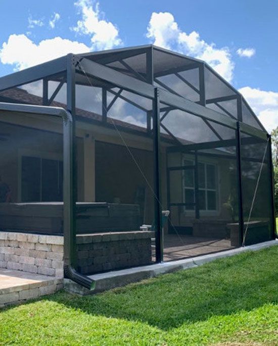 A screened in porch with a roof that looks like a dome.