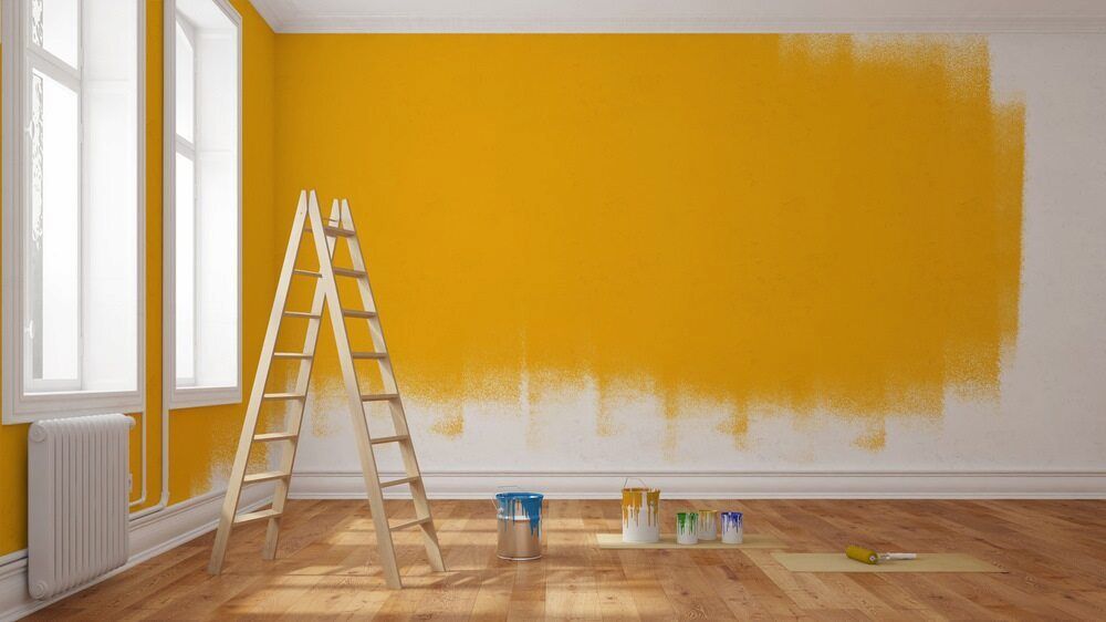 An Empty Room With Yellow Walls And A Wooden Ladder — L & S Wirth Painting in Parkes, NSW