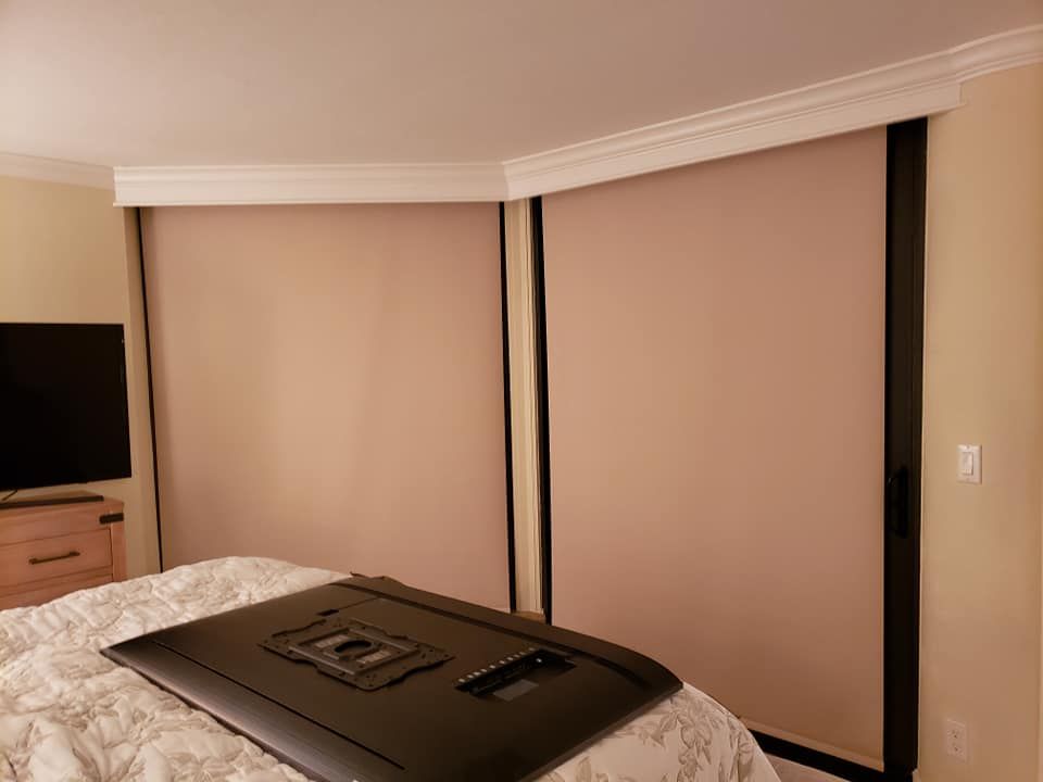 Black velvet curtains hanging vertically.