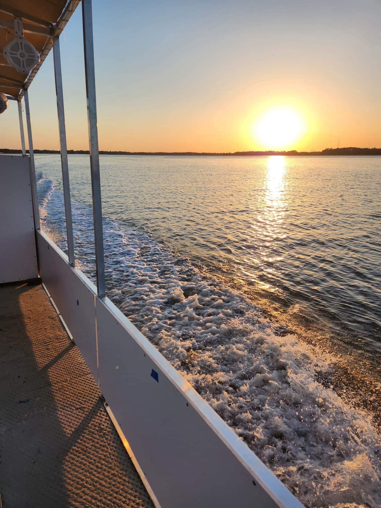 The sun is setting over a body of water