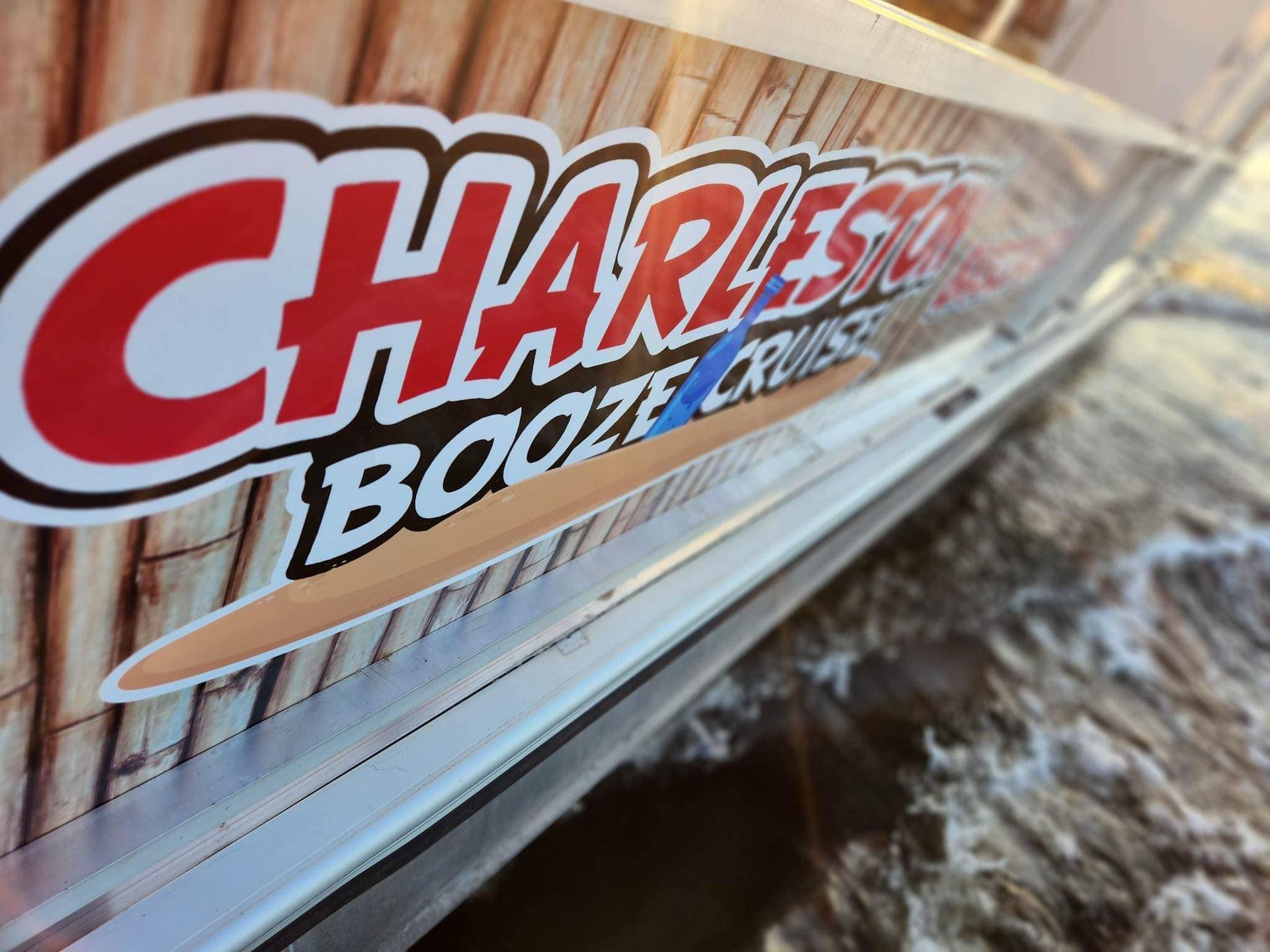 The word charleston is on the side of a boat