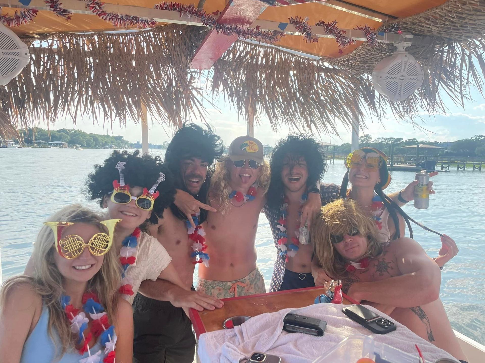 A group of people are posing for a picture on a boat.