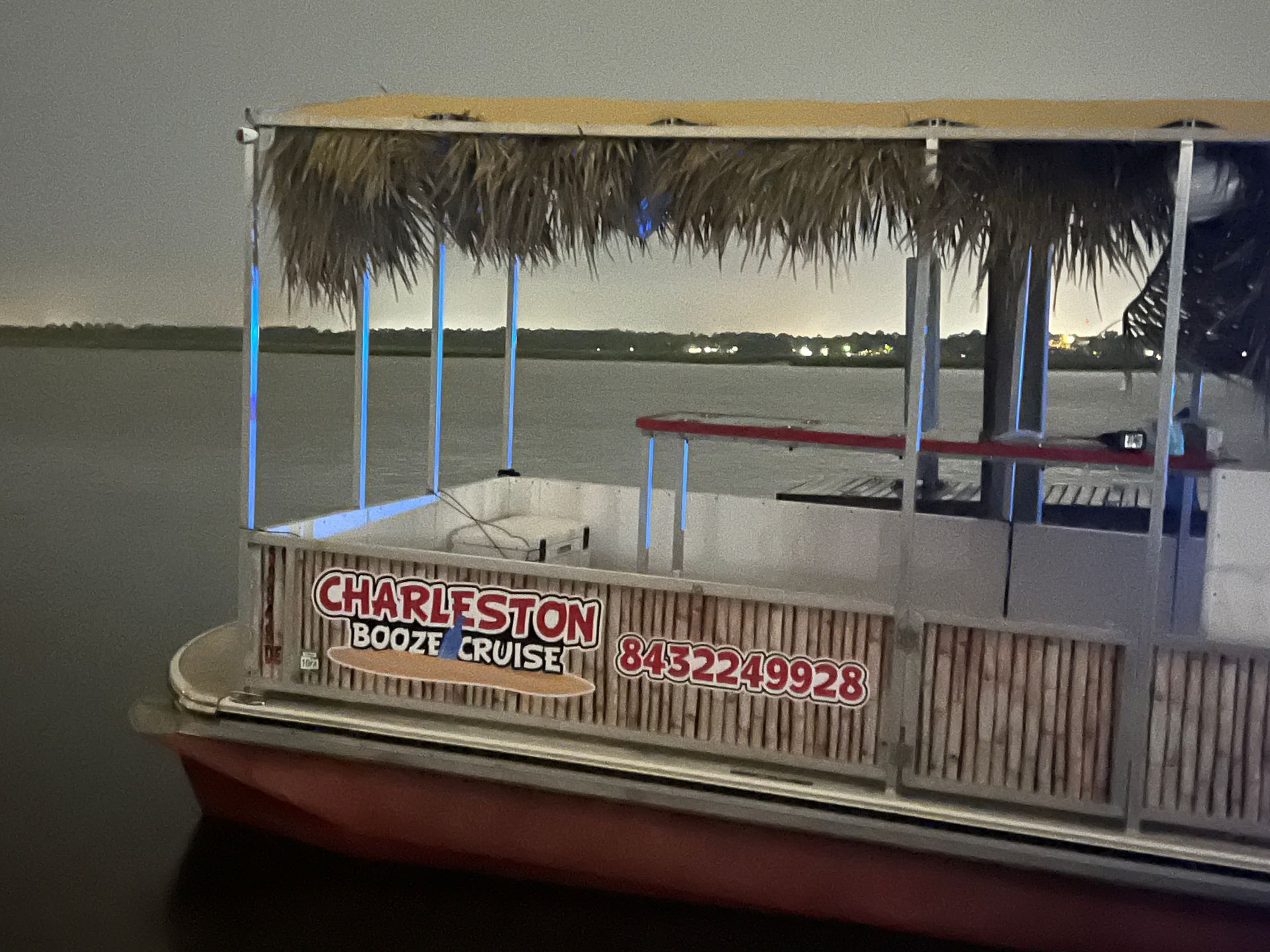 A boat that says charleston on the side of it