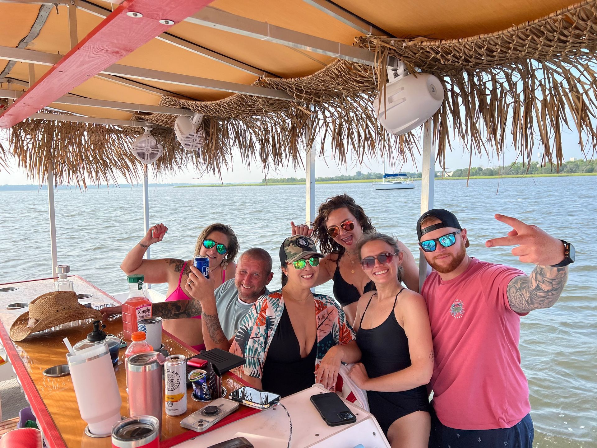 A group of people are posing for a picture on a boat.