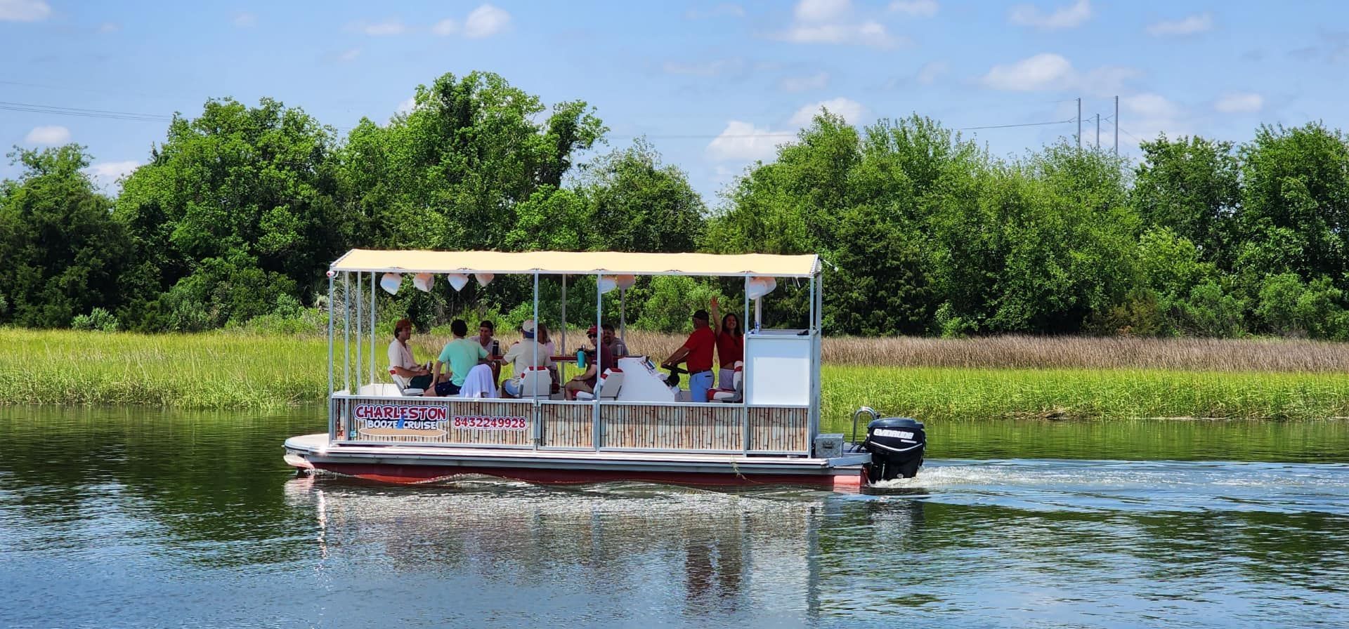A boat with people on it is floating on a lake.