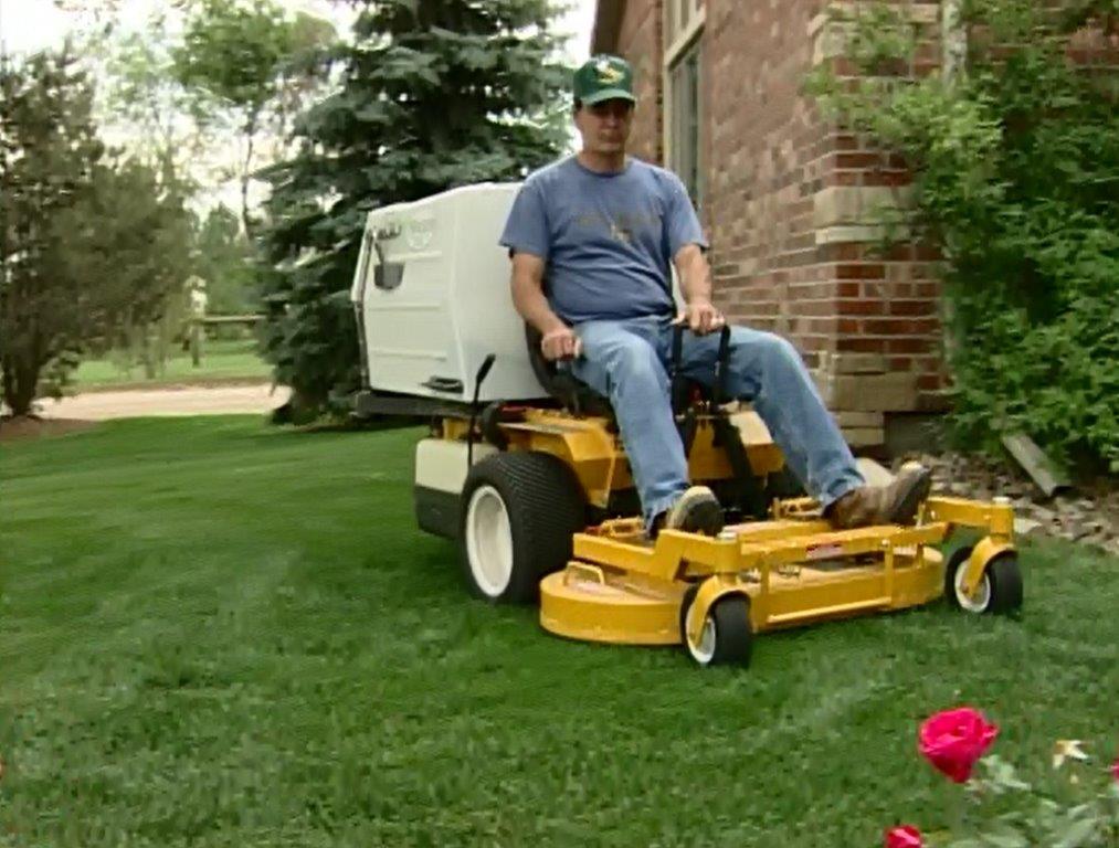 yellow riding lawn mower