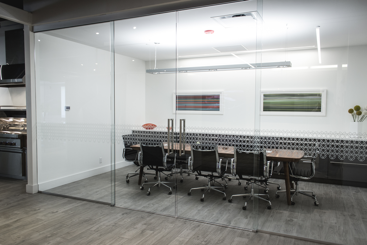A conference room with a table and chairs in it