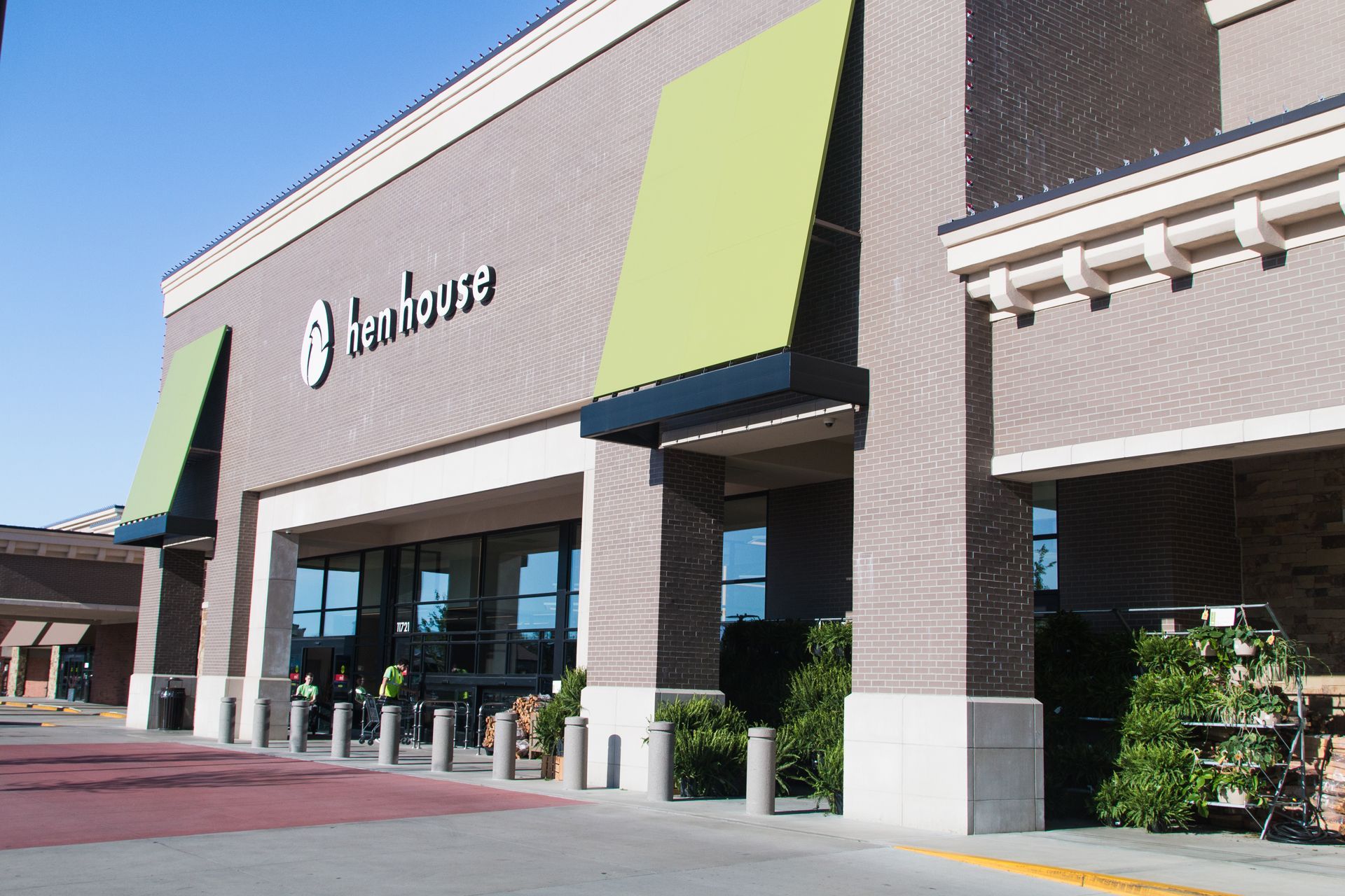 A store front with a green awning that says terrace