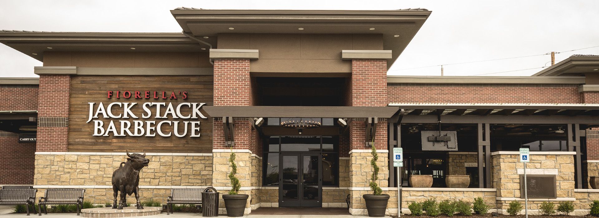 A brick building with a sign that says jack stack barbecue