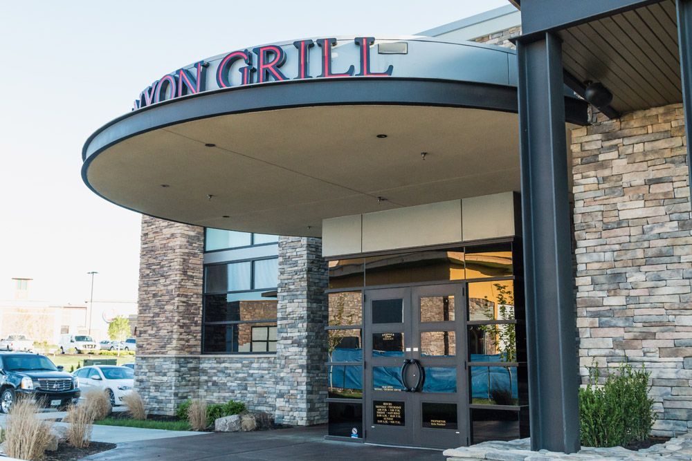 A restaurant with a sign that says ' avery grill ' on it