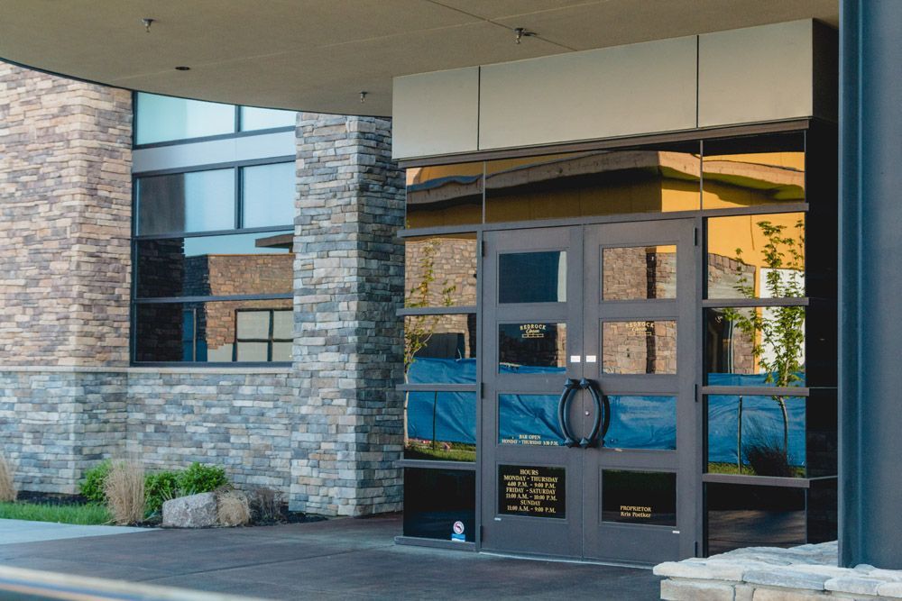 A large building with a lot of windows and doors.