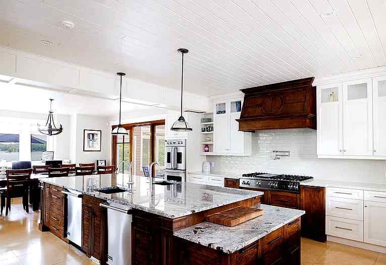 There is a large island in the middle of the kitchen.