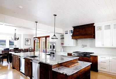 There is a large island in the middle of the kitchen.