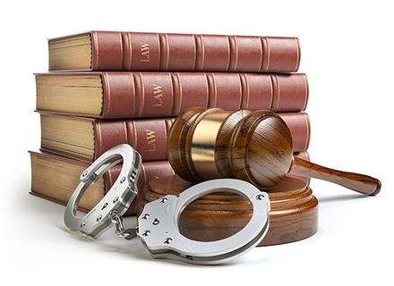 Defense — Judge Gavel and Handcuffs with Legal Books in Bolton Landing, NY