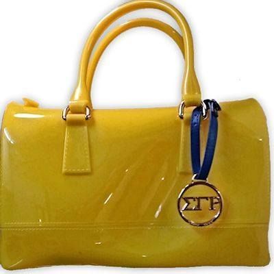 A yellow purse with a blue strap and a sticker that says etp