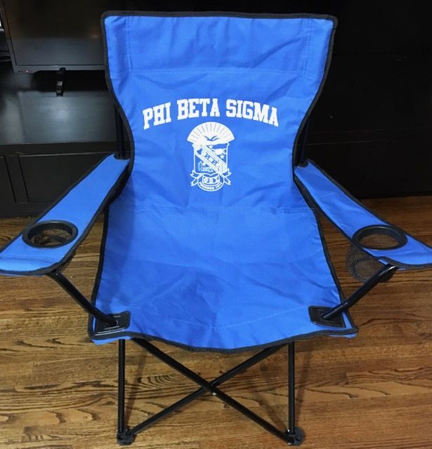 A blue folding chair that says phi beta sigma on it