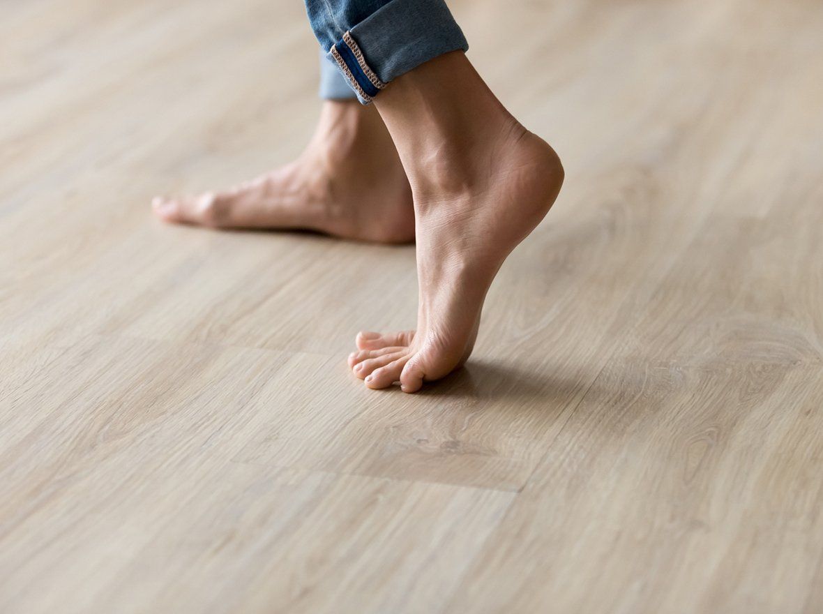 Person Walking in Hardwood Floor — Odessa, TX — Crenshaw Flooring