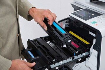 Man repairing the printer — Blueprint Copying in Bristol, VA