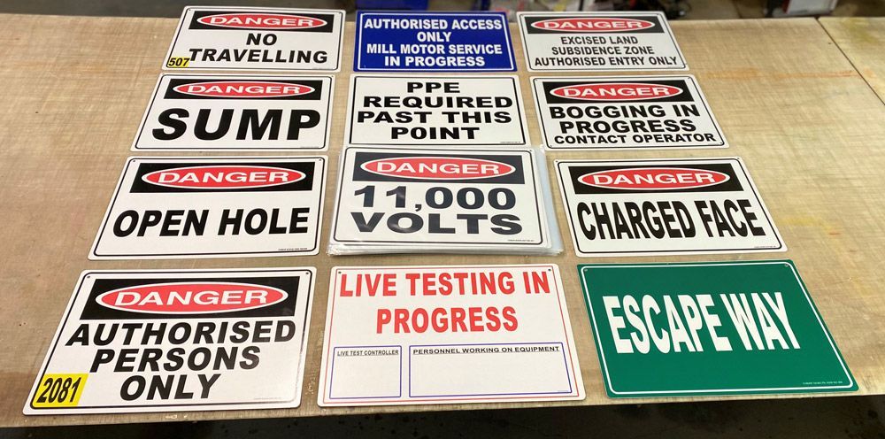 Different Safety Signs on Top of Table