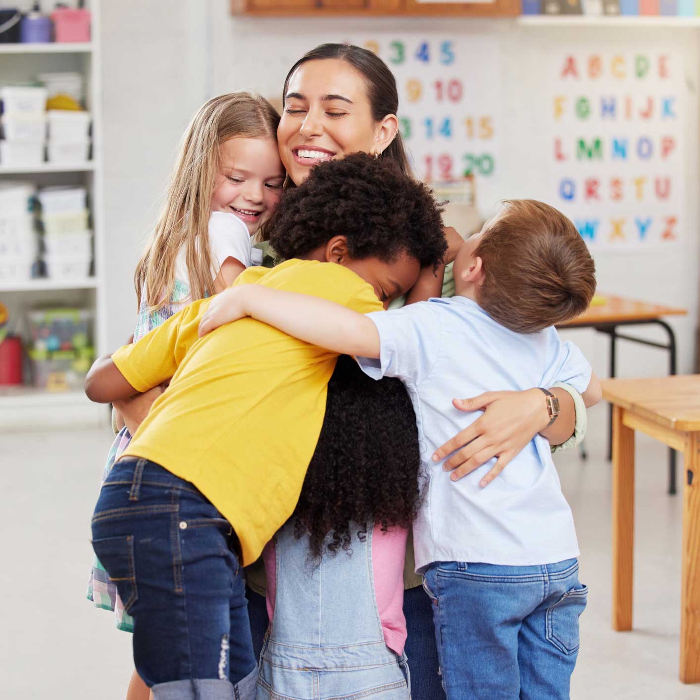 Kids hugging their teacher — Richfield, NC — Richfield Child Development Center