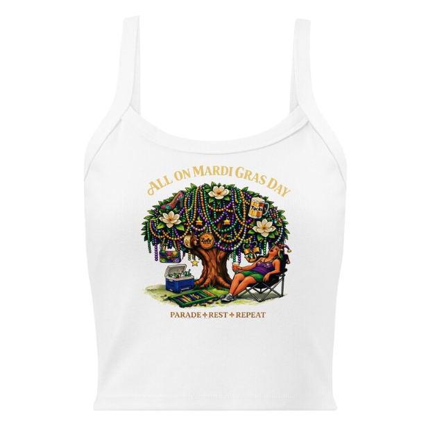 A person rests in a lawn chair under a tree decorated with Mardi Gras beads, with a cooler and parade items nearby.