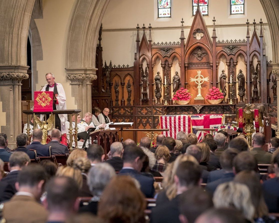 The Reverend Timothy A.R. Cole at pulpit with a full church of worship servicee