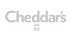 A black and white logo for cheddar 's bakery and butcher.