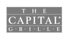 A black and white logo for the capital grill.