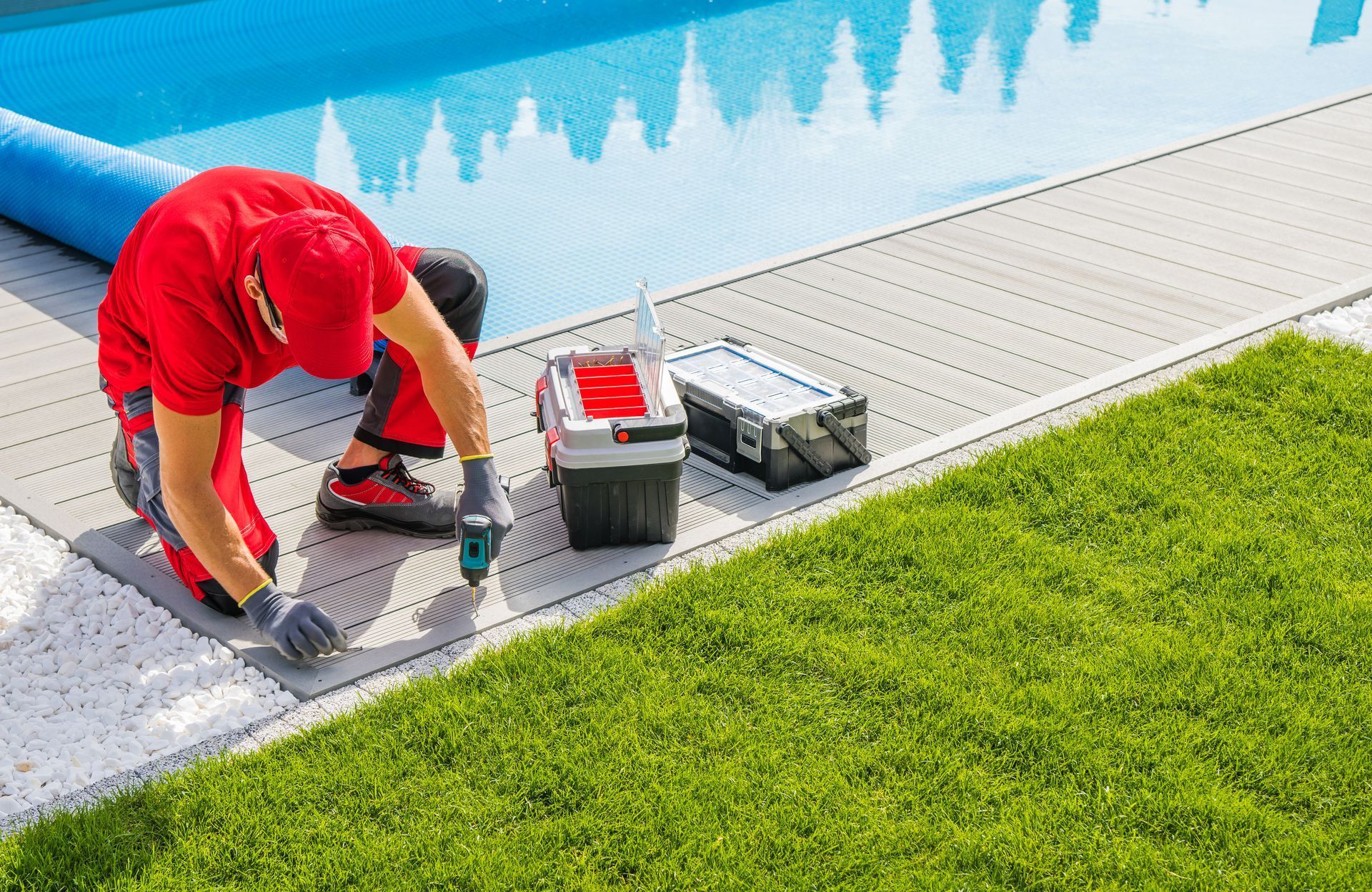 A man is working on a swimming pool.