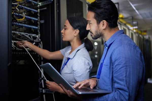 workers doing IT maintenance for large company 