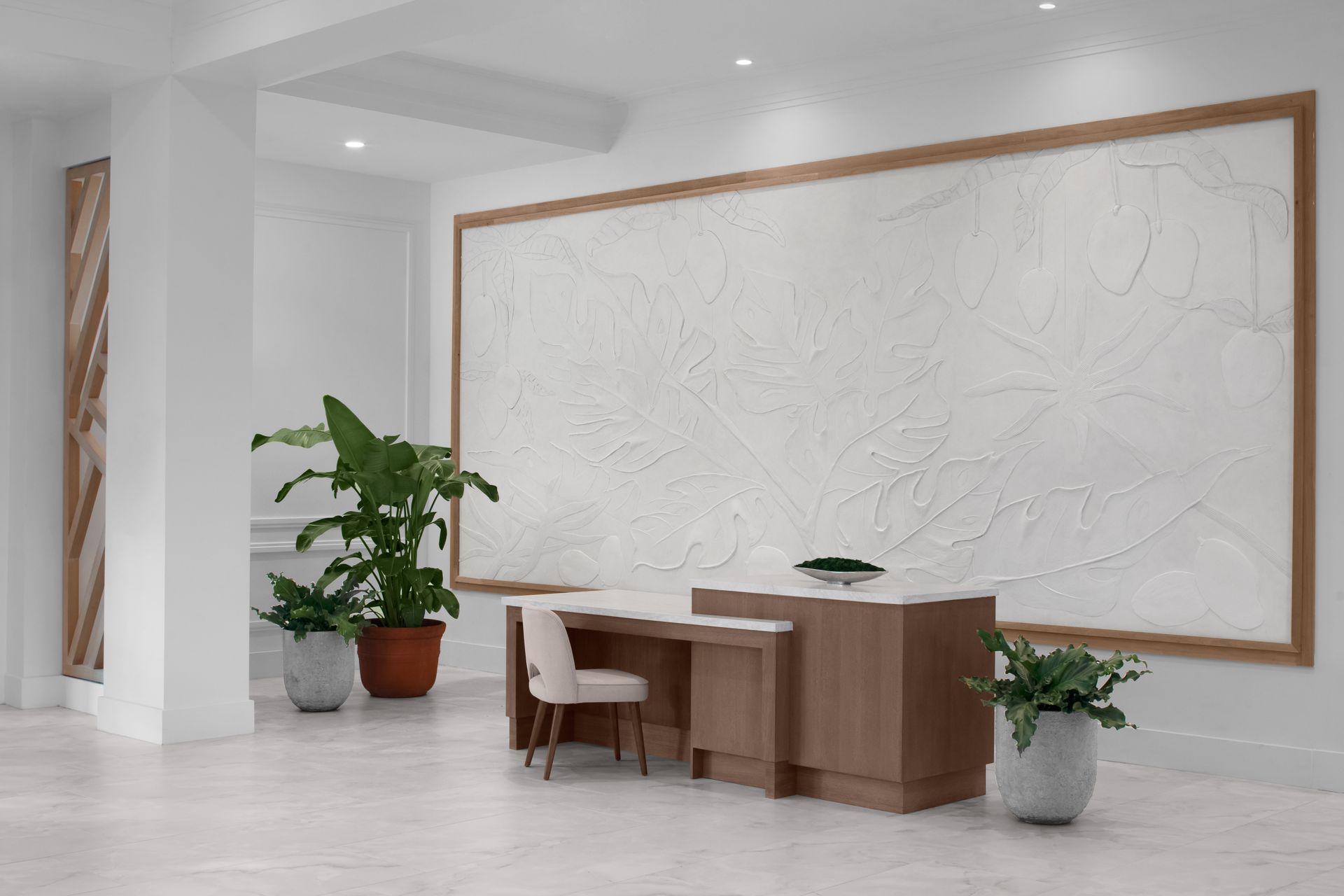 There is a large white board on the wall in the middle of the room.