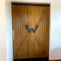 A barn door door installation in Eagle River ID call Eagle River Door & Glass