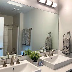 A bathroom mirror installation in Eagle River ID by Eagle River Door & Glass