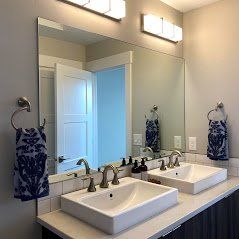 A bathroom mirror installation in Eagle River ID by Eagle River Door & Glass