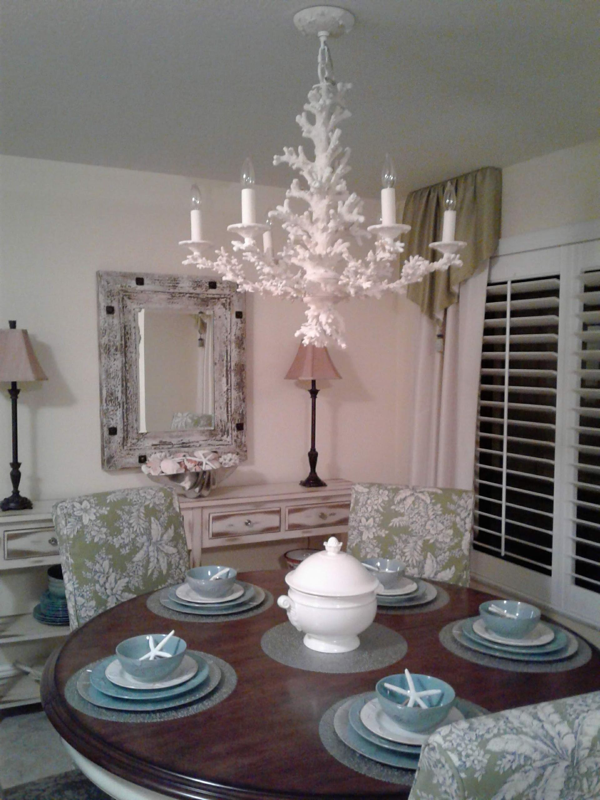 Person in yellow gloves scrubbing a toilet with a brush.