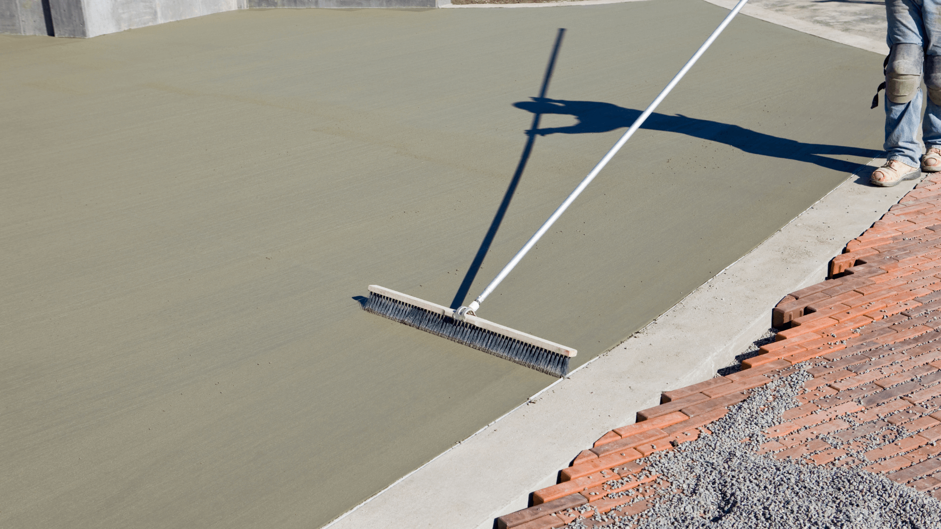 Professional concrete contractor prepares a concrete slab