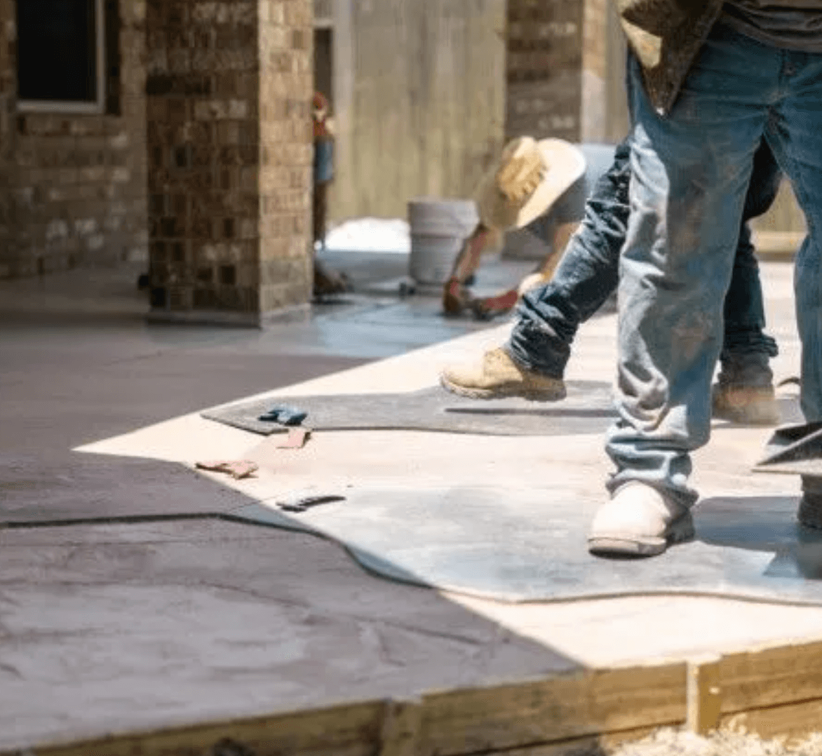 Stamped concrete contractor works on a new custom walkway in Blaine, MN