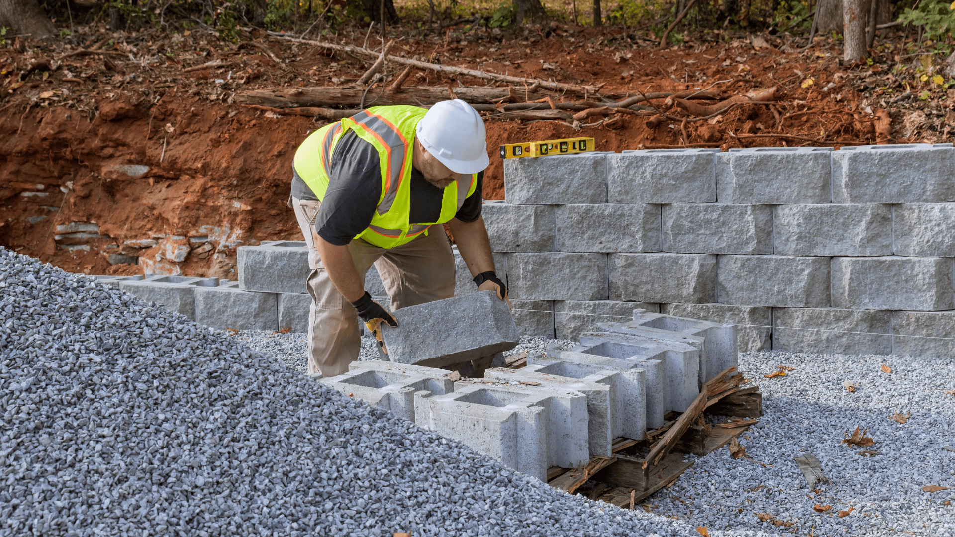 A retaining wall specialist stacking up landscape blocks in Blaine